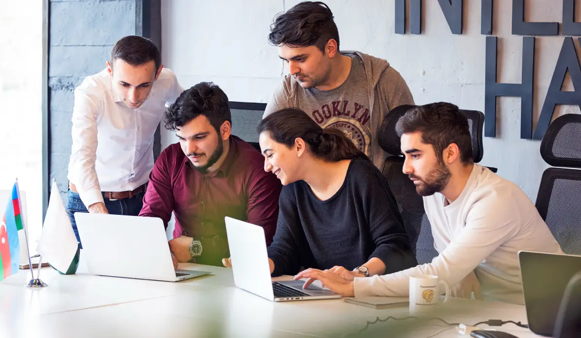 Colleagues working on a project and discussing details.